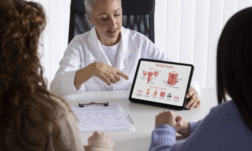 high-angle-doctor-presenting-with-tablet (1)